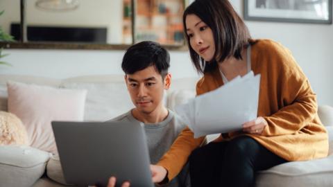 Couple comparing mortgages - stock shot