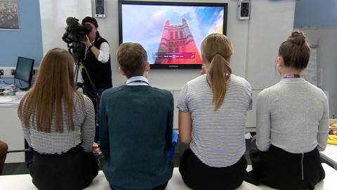 Students being filmed watching political programme