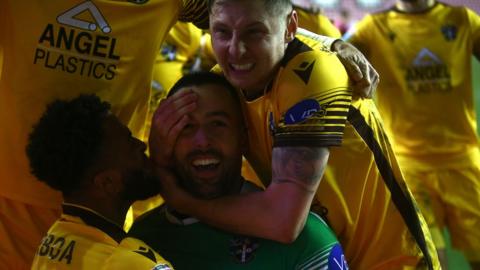 Sutton United celebrate their EFL Trophy semi-final win over Wigan