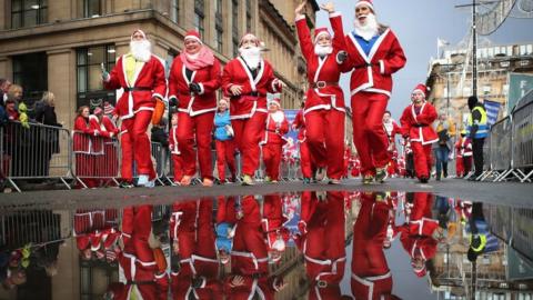 Over seven thousand members of the public taking part in Glasgow's annual Christmas Santa dash through the city centre on 8 December , 2019.