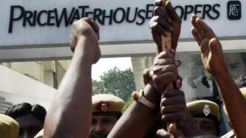 Members of the Communist Party of India (CPI) protest outside the office of PricewaterhouseCoopers, the auditing firm for the scandal-hit Satyam Computers, in Hyderabad on January 20, 2009 calling for the closure of the audit firm and the cancellation of license.