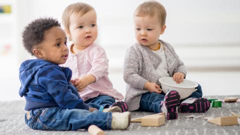 A group of three babies