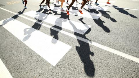 Runners in shadow
