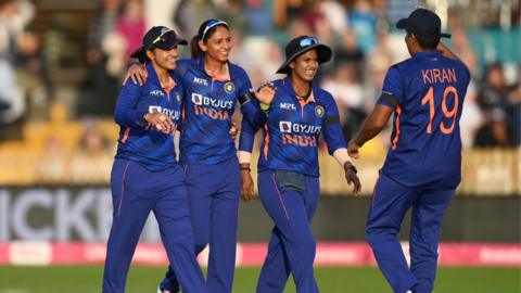 India players Sneh Rana, Harmanpreet Kaur and Deepti Sharma of India celebrating a wicket