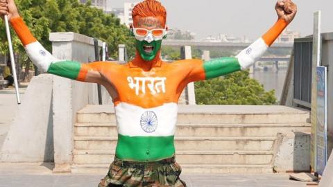 An Indian fan cheering in Ahmedabad