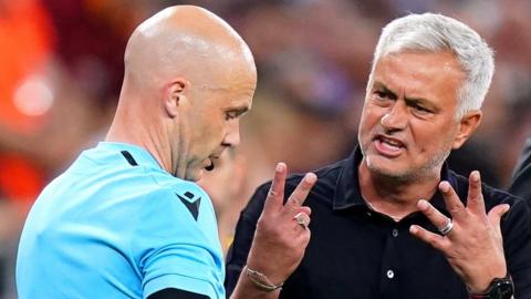 Roma coach Jose Mourinho confronts referee Anthony Taylor during the 2023 Europa League final