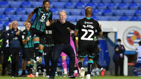 Swansea players and staff celebrate