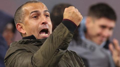 Sabri Lamouchi celebrates