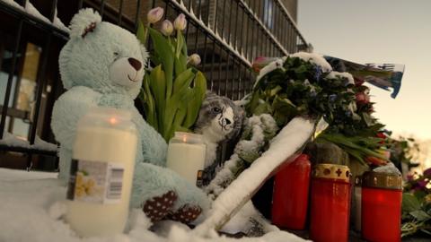 Candles and soft toys left in memory of those killed