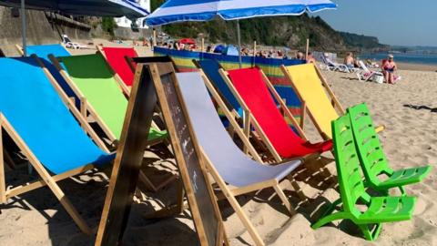 Deck chairs on Tenby North Beach, Pembrokeshire