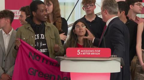 Sir Keir Starmer addresses protesters who interrupt his speech.