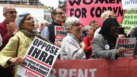 Protesters outside the NEC meeting