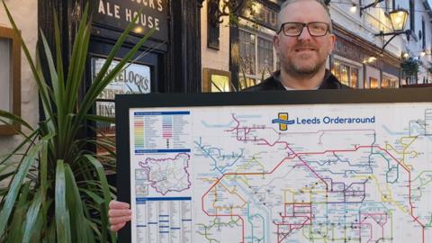 Steven Lovell with his Leeds map