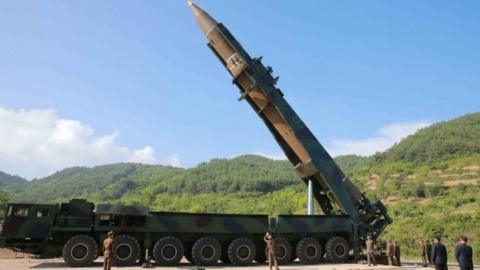 North Korea's Kim Jong-Un (2nd R) inspects the test-fire of an Intercontinental Ballistic Missile in July 2017