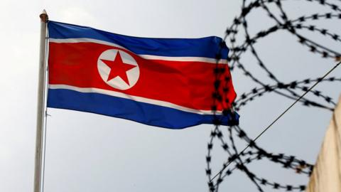 A North Korea flag flutters next to concertina wire at the North Korean embassy in Kuala Lumpur, Malaysia March 9, 2017.