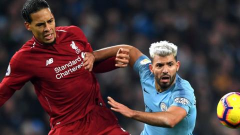 Liverpool’s Virgil van Dijk takes on Man City Sergio Aguero