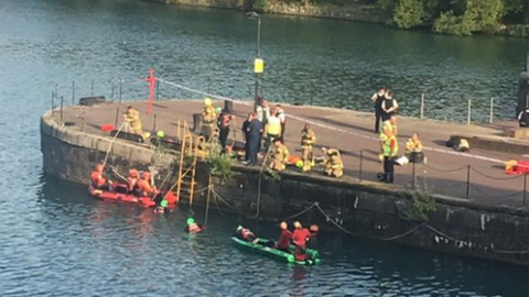 Police and rescue services search for the missing man at Shadwell Basin, Wapping