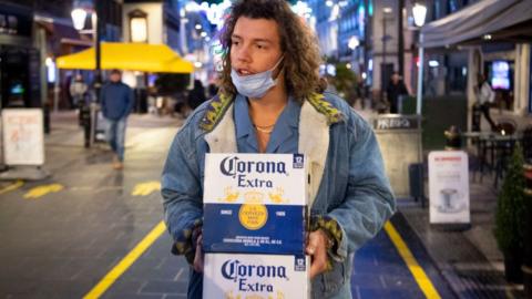 Man carrying boxes of beer