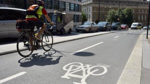 Man on cycle path in London