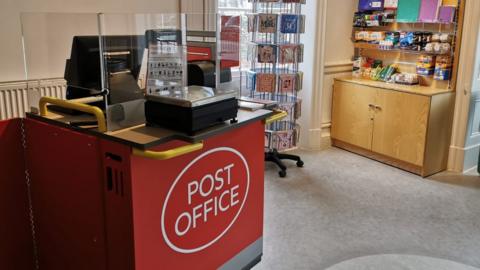 Post Office counter at Conwy Tourism Information Centre