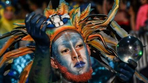 Revelers perform during the Myths and Legends parade in Medellin, Antioquia department, Colombia on December 8, 2019. (