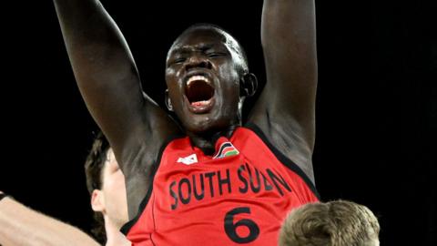 Khaman Maluach slam dunks during the international friendly basketball game between Australia and South Sudan in Melbourne