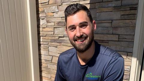 James Molluso pictured outside a house in New York where he works