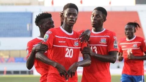 Gambia striker Adama Bojang celebrates