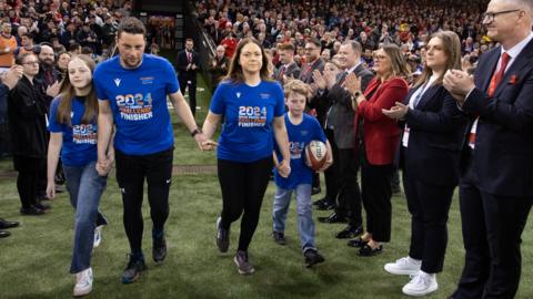 Craig Maxwell and his family with the match ball at the Principality Stadium.