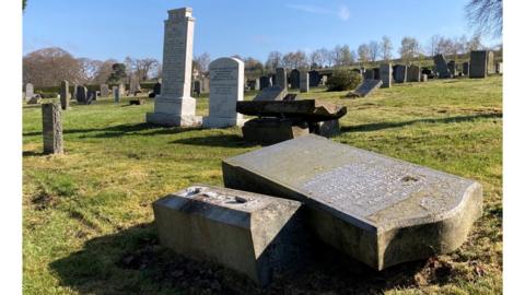 Gravestone toppling has been controversial since being introduced in 2018.