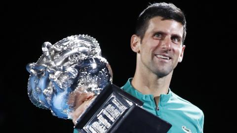 Novak Djokovic lifting the trophy at the 2021 Australian Open