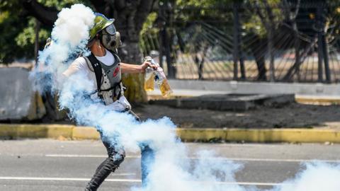 An anti-government protester with Molotov cocktails