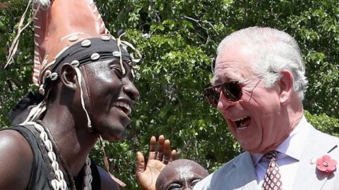 Prince Charles, Prince of Wales is greeted by traditional dancers during a tour of Christiansborg Castle on November 3, 2018 in Accra, Ghana
