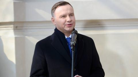 Polish President Andrzej Duda speaks during the celebrations in front of the commemorative plaque at the University of Warsaw