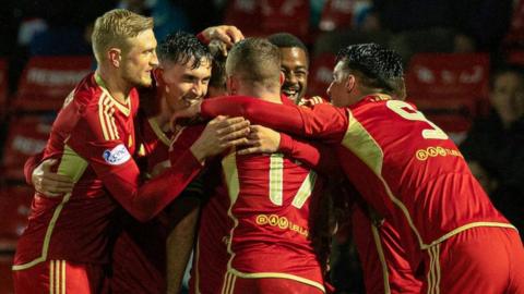 Aberdeen celebrate their first goal