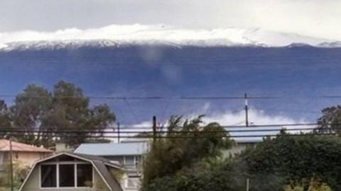 The summit of Mauna Kea on Hawaii's Big Island covered in snow (02 December 2016)