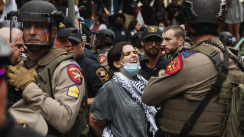 Police detain a demonstrator during a pro-Palestinian protest at the University of Texas in Austin, on Wednesday, April 24, 2024