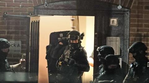 Armed police at flats in Reading after park stabbings