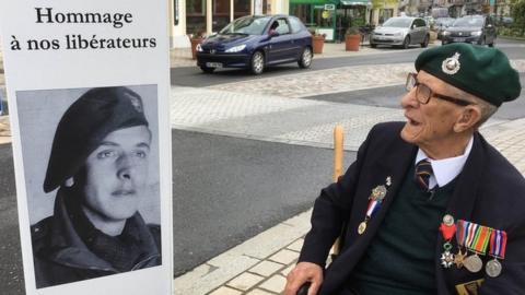 Ted at Pont L’Eveque for the 75th anniversary of the D-Day landings. He found an old photo of himself on one of the town's lamp-posts, described as one of the town’s liberators