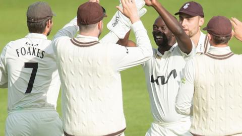 Kemar Roach celebrates wicket