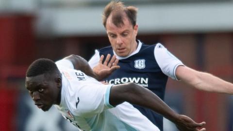 Raith's Fernandy Mendy (left) in action with Paul McGowan