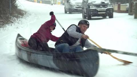 Two men canoe