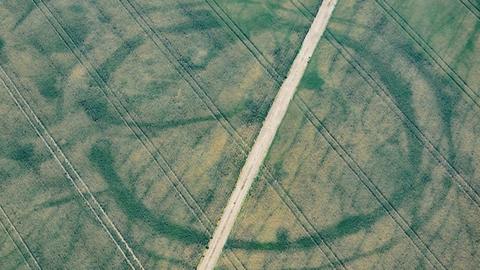 Crop marks of prehistoric enclosure in the Vale of Glamorgan and faint footings of a suspected Roman villa