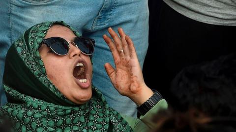 A protester shouts slogans as she protest against the violent clashes at the Jawaharlal Nehru University (JNU) campus in New Delhi