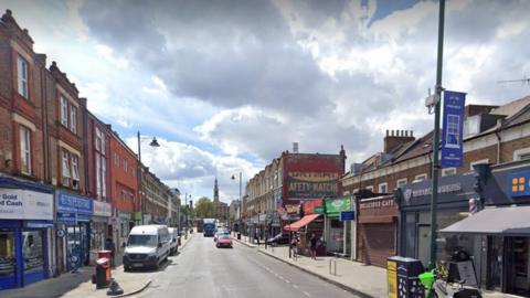 Google StreetView image of shops along Norwood Road.