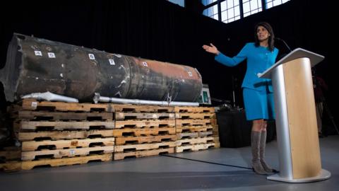 Nikki Haley gestures towards the remnants of a ballistic missile that came close to hitting Riyadh's airport in November, at Joint Base Anacostia in Washington on 14 December 2017