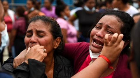 Family members react outside the Penitenciaria del Litoral prison where inmates were killed and injured in overnight violence, in Guayaquil, Ecuador, 13 November 2021