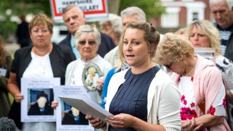 Bridget Reeves (centre) and the families of other victims speak to the media after the disclosure of the Gosport Independent Panel's report