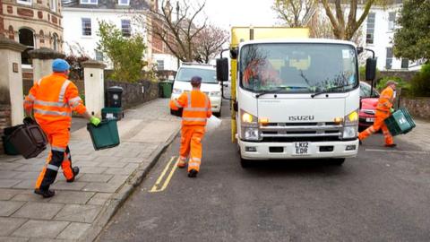 Bristol Waste staff clearing bins