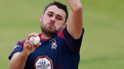 Nathan Buck bowls for Northants